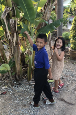 My nickname, Bai Dtong, means big banana leaves. Some cute neighborhood kids started to do our secret hand shake with REAL bi