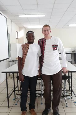 Volunteer and Counterpart facing camera
