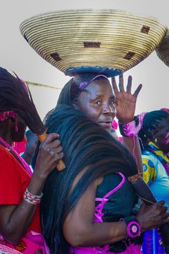 My Namibian mother bringing a gift on her head to the bride and groom.