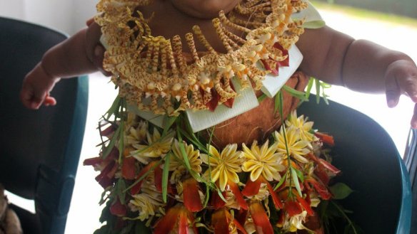 This little peanut's mom dressed her up in traditional Tongan clothing.