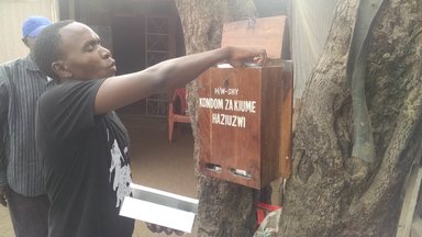 Edwin Filling the Condom Box