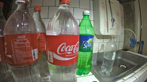 Our bottles of purified drinking water and the water filter, top right.