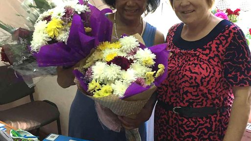 Volunteer Donna B., formerly a professor at Howard University, and her partner Eudochia Babalici, school director.