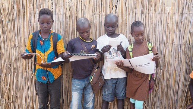 Nearly 80 Edison students wrote stories in French for elementary students in Senegal and art students at the school illustrat