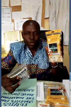 Principal of school in Cameroon with solar lamps