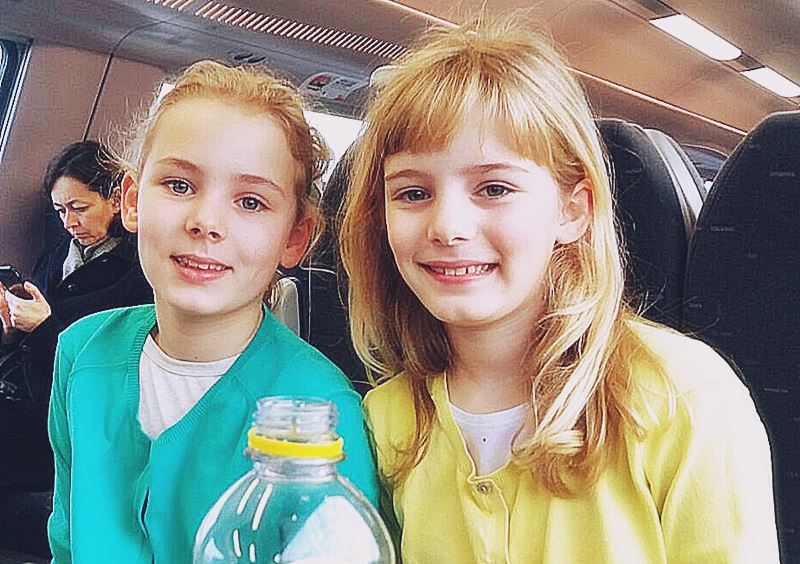 Via WhatsApp : Papa we are alive !! Lily and Clara in the last train back to Brussels downtown before city lock down after airport bombing ... not a normal smile !