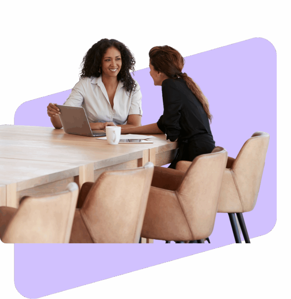 two people meeting at a conference room table