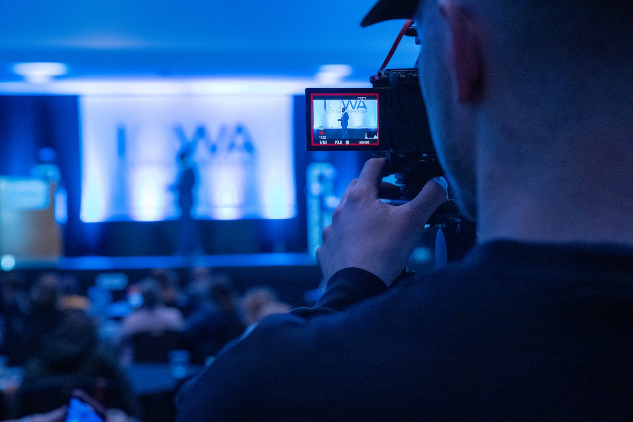 videographer filming a keynote