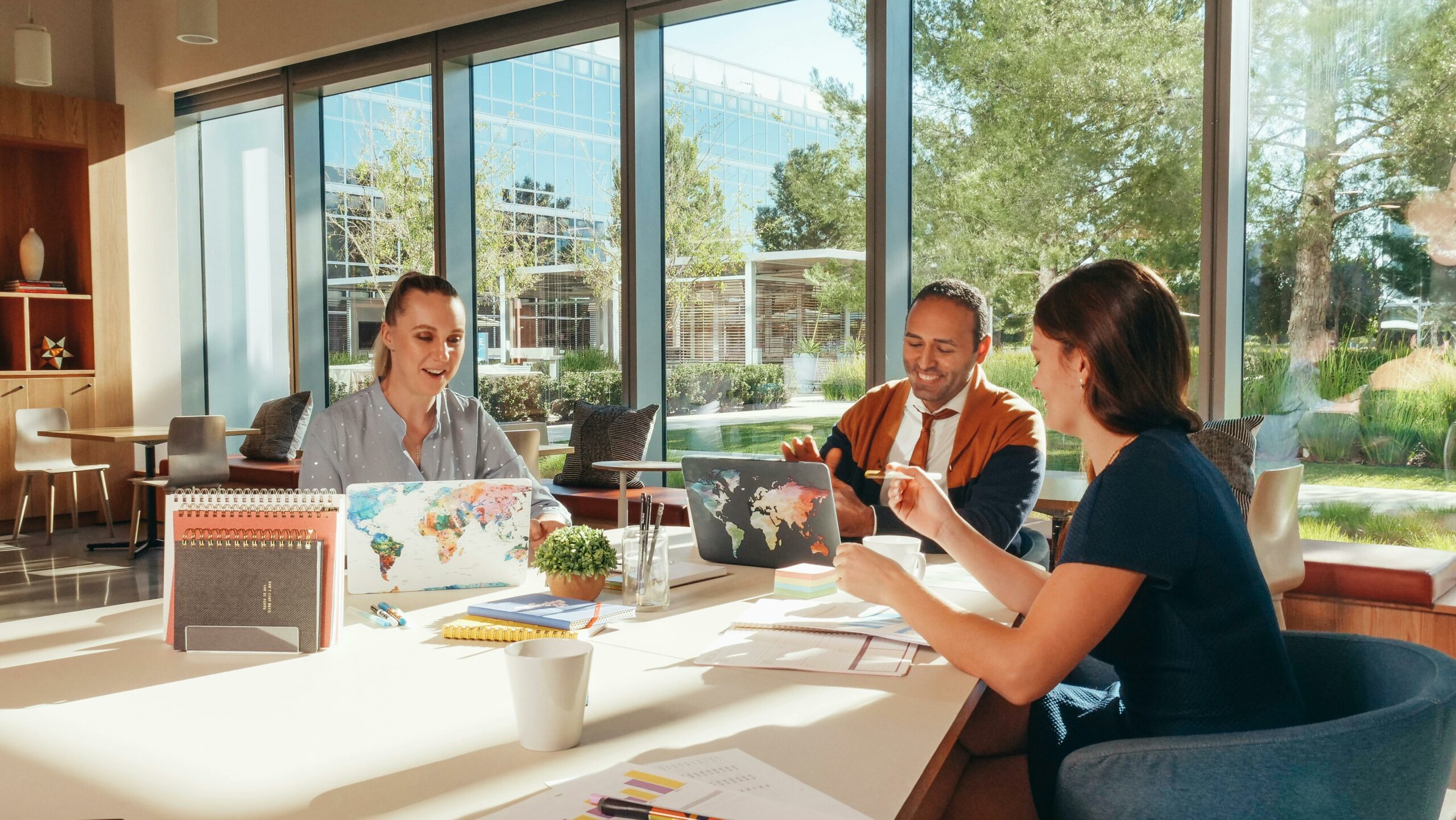 Association team collaborating on event sponsorship planning in a bright, modern meeting space.