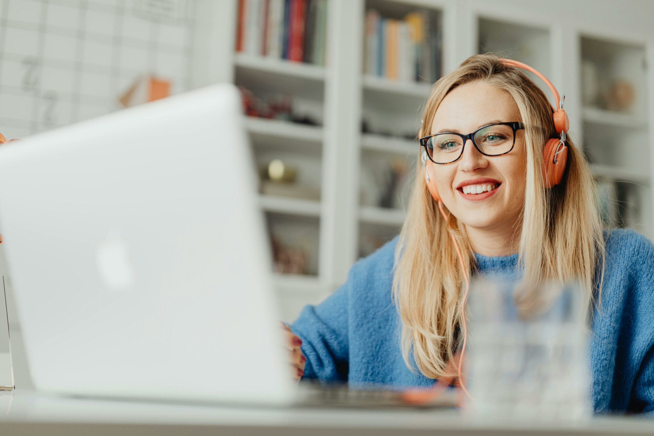 Association member smiling during an online session, representing connection and engagement through digital media.