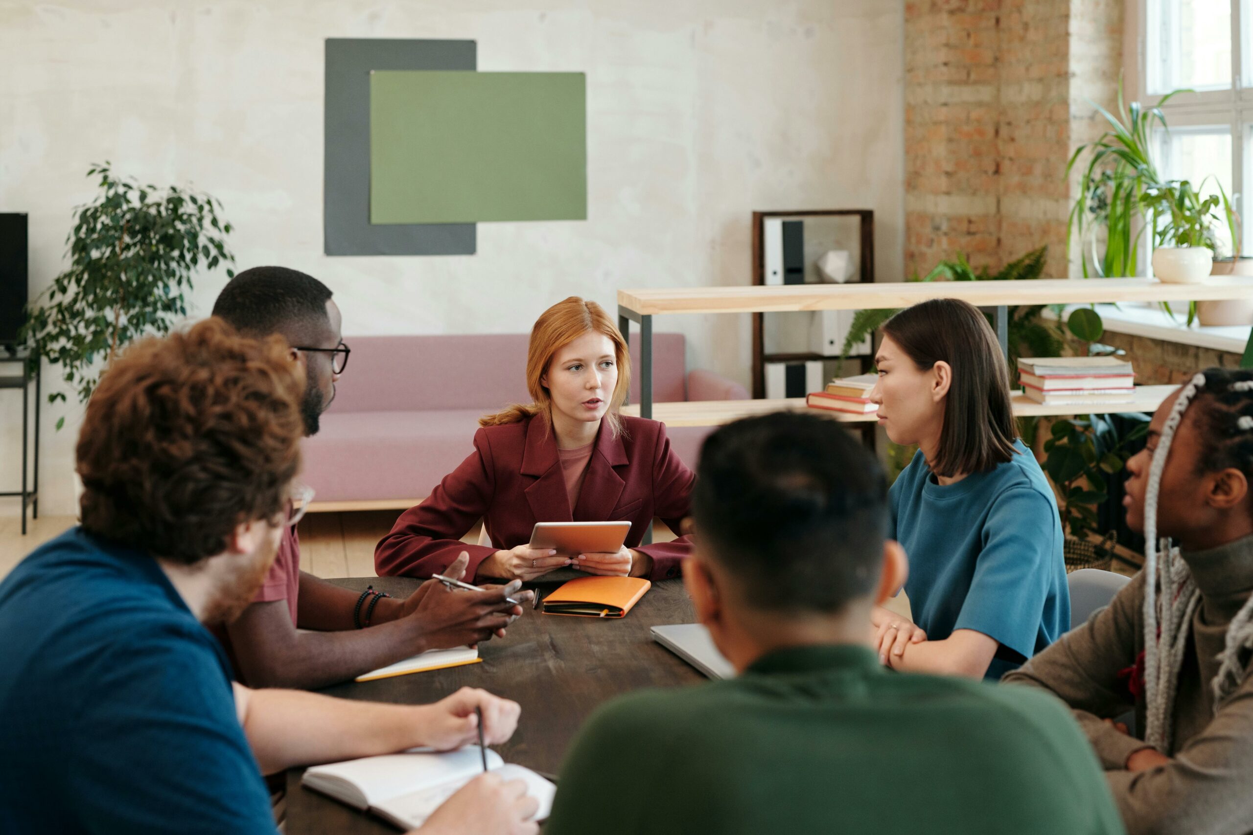 A group of association members are having a bit-sized learning session in a conference room