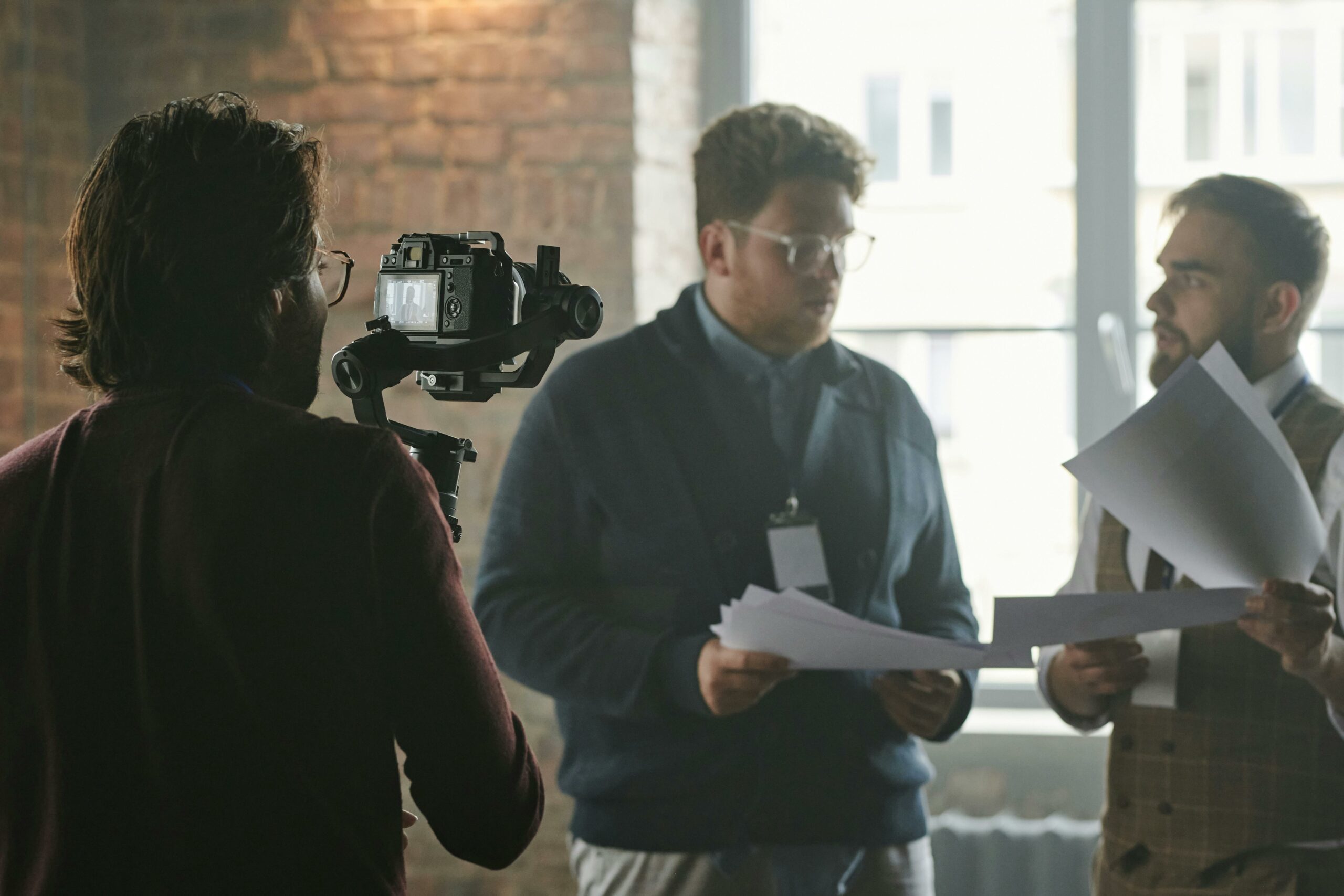 two men are featured in a video content and they are talking about sponsored video strategy before the shoot