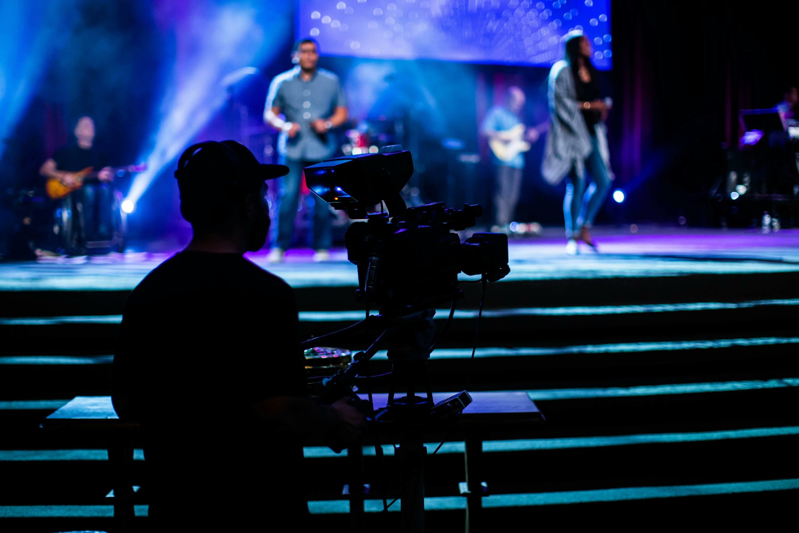 A guy us setting up the livestream setup for an association’s event