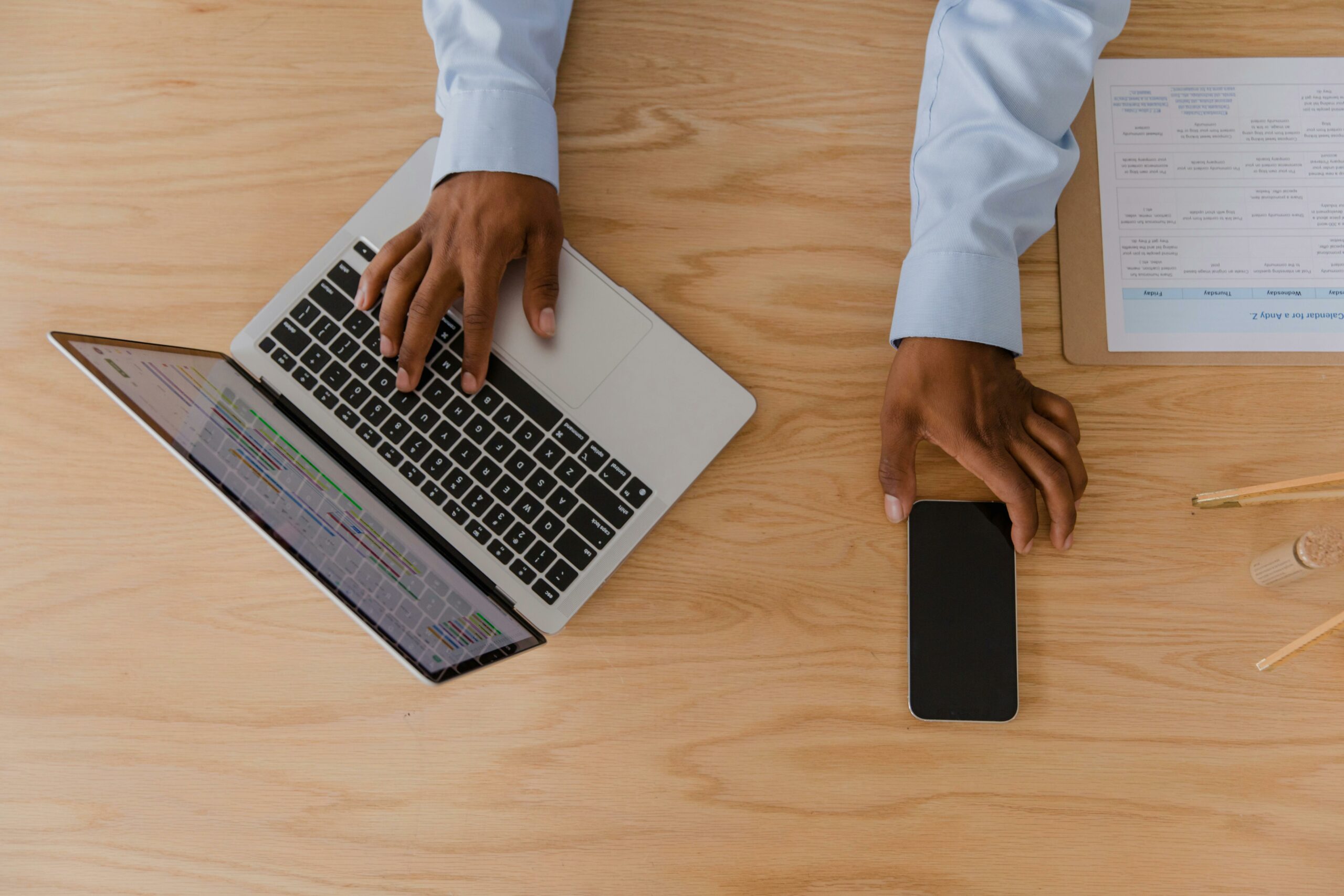 A man is working on his laptop and is strategizing to optimize the email subject to boost the open rate