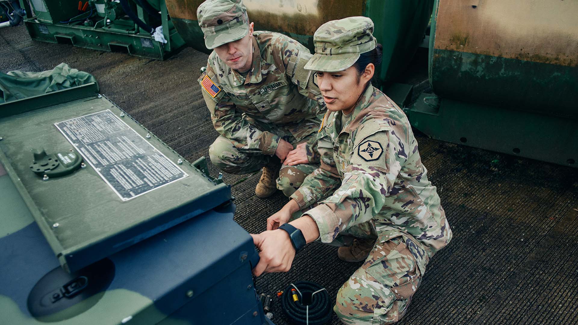 Daisy Aguilar showing a service member what to look for. 