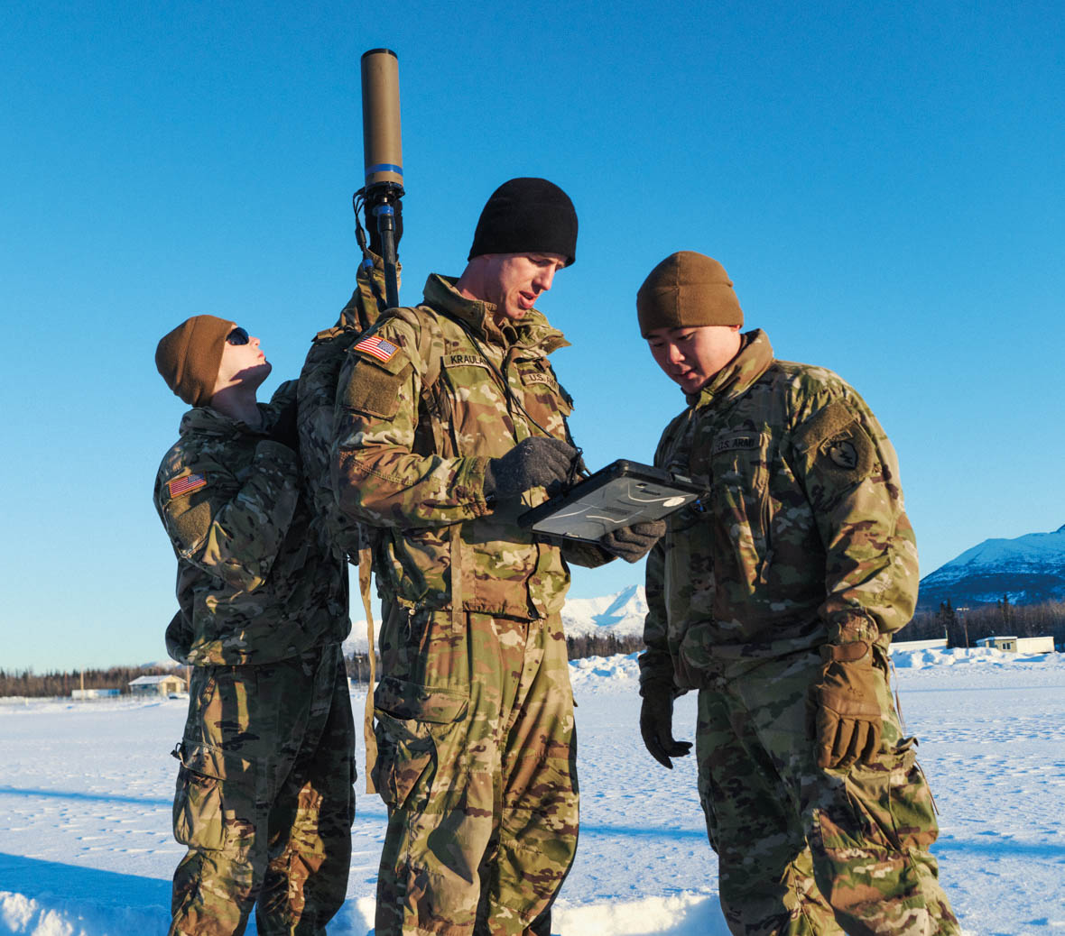 adam krauland gets help from colleagues setting up equipment