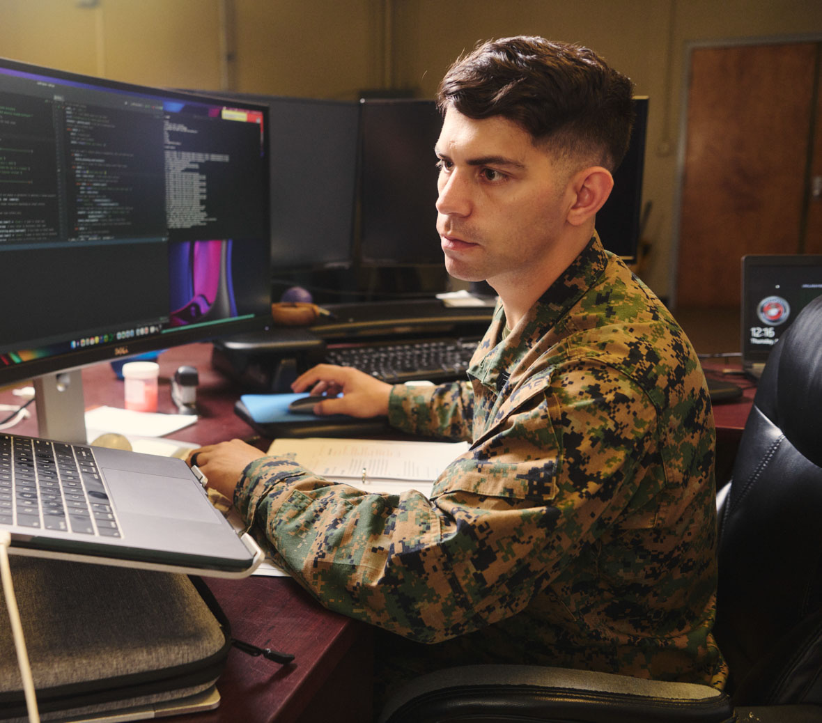 mike works on his computer at his terminal