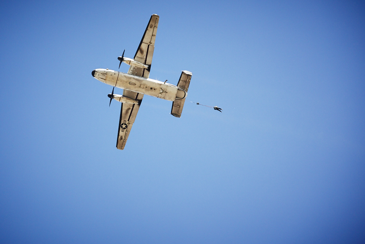 a Navy plane with a paraglider