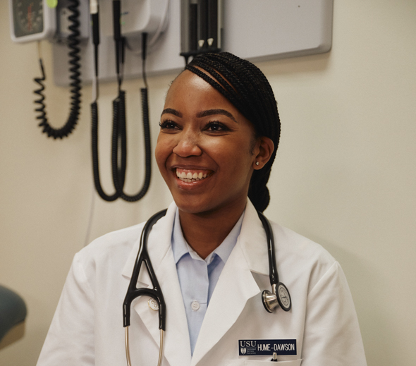 brittany smiles in her doctor's coat