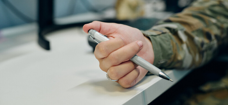 close up of Hope holding her pen