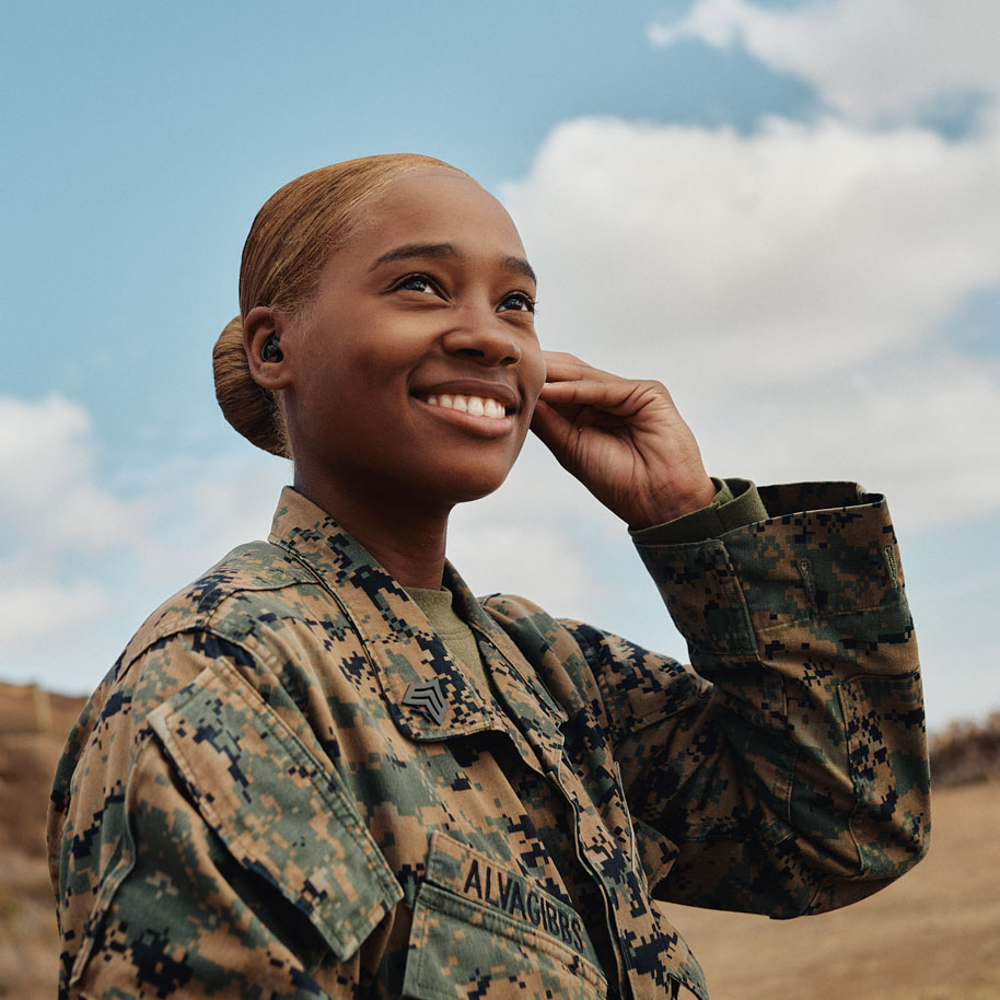 Sgt. Gibbs fixes her ear protection on the range