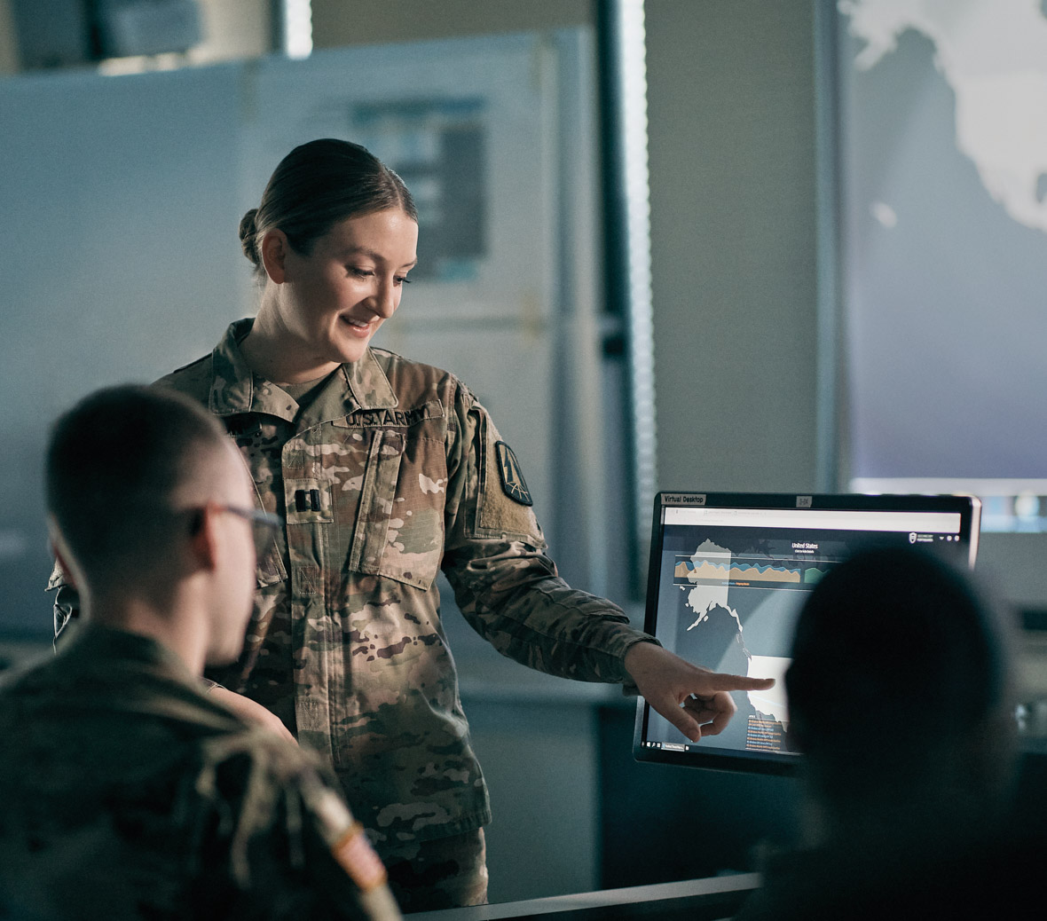 shaelyn points to something on screen for her colleagues