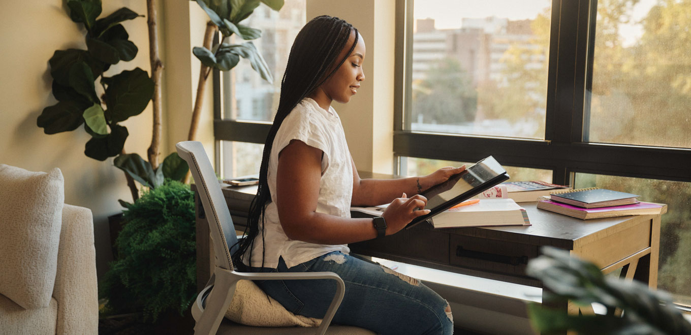 Brittany studies at her desk