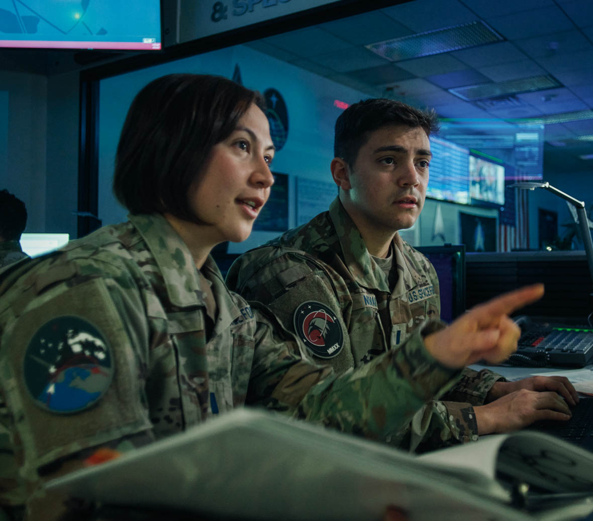 Jon Novak discusses something with a colleague