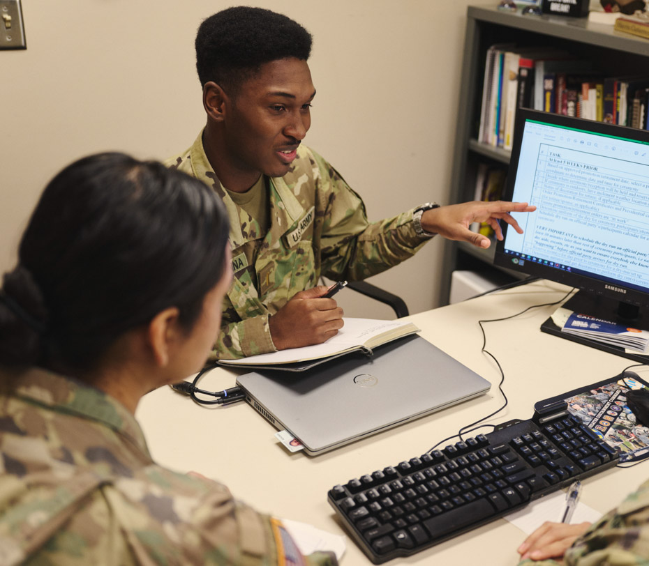 soldier discusses plans on the computer screen