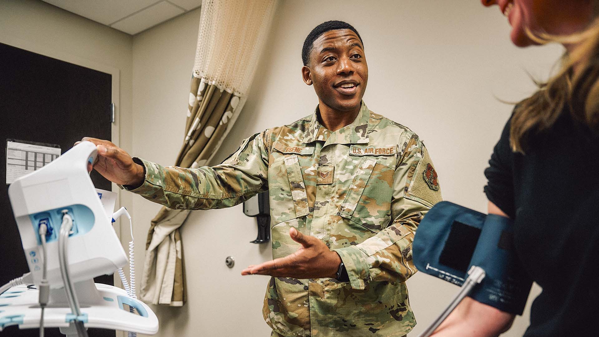 Isaac showing a patient the monitor