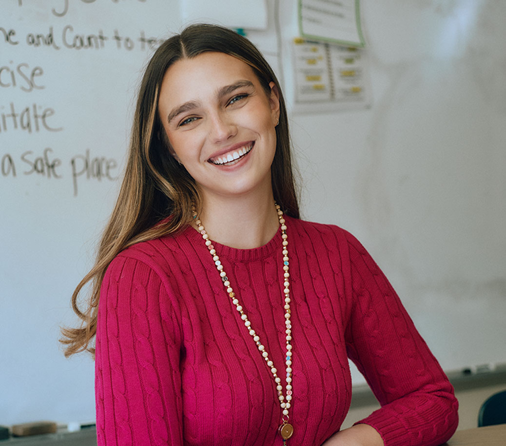 Laura Kate smiles in class room