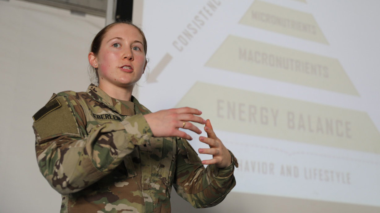 dietician presents in front of a projector screen