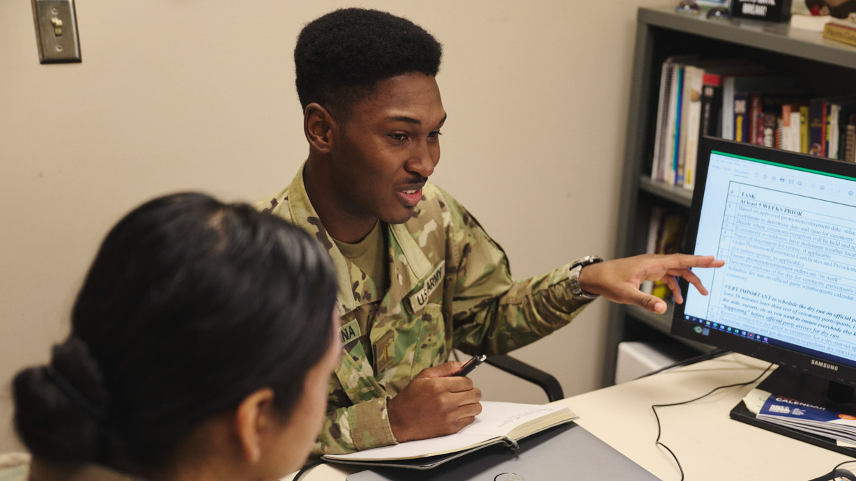 Human resource managers read data on the computer screen