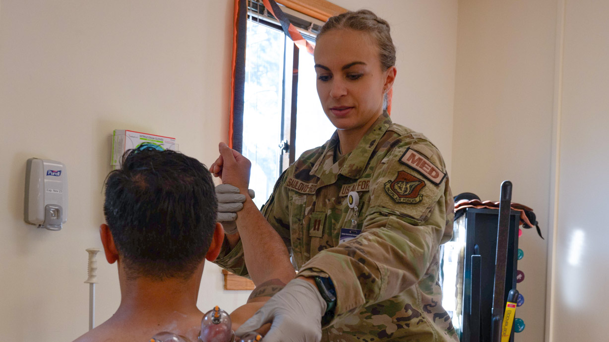 physical therapy specialist at work with a patient