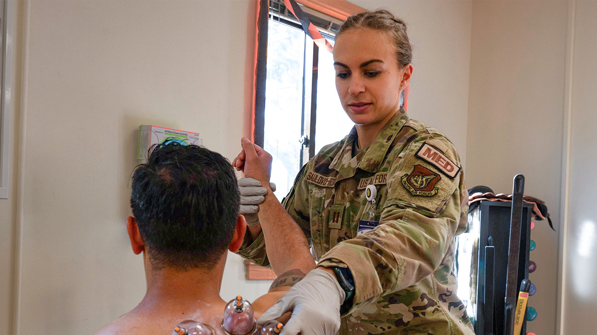 physical therapy specialist at work with a patient