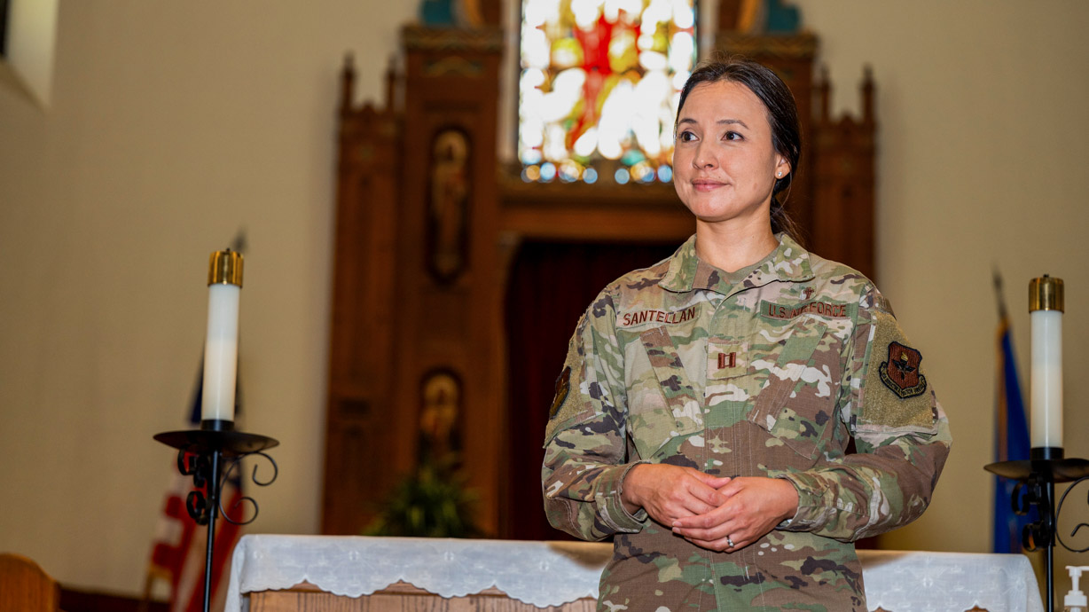 Chaplain stands at an altar