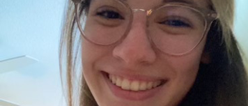 Woman with glasses and long, brown hair