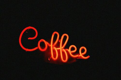 Red neon sign that says coffee