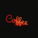 Red neon sign that says coffee