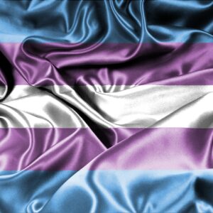 Satin trans* flag with light blue, light purple, and white stripes