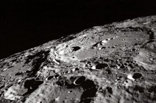Black and white image of moon's pocked surface