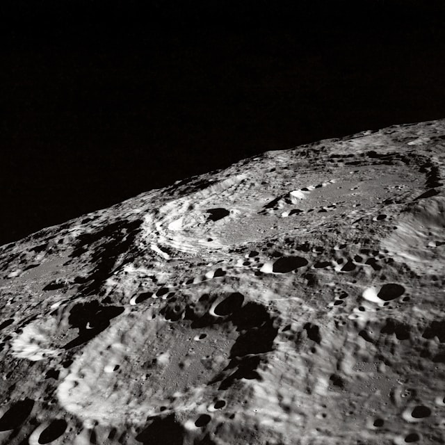 Black and white image of moon's pocked surface