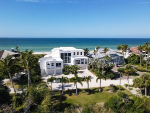 beautiful 2-story white home on beachfront