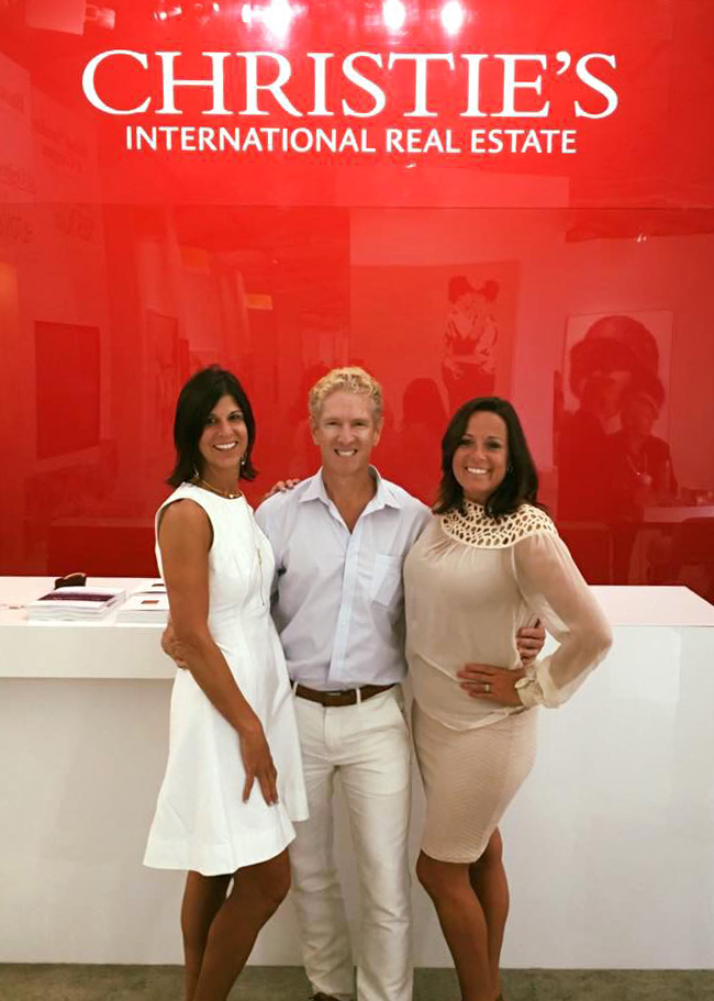 Michael Saunders & Company agents, Julia DeCastro and Christine del Monte, with Rick Moeser, Senior Vice President, Southeast Regional Manager of Christie’s International Real Estate.