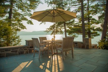 Patio dining area at sunset, Crosswinds, Kattskill Bay, NY NY0316-23