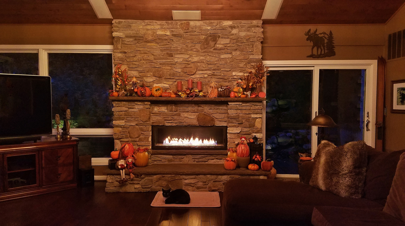 Fireplace with pumpkin decorations for the fall season
