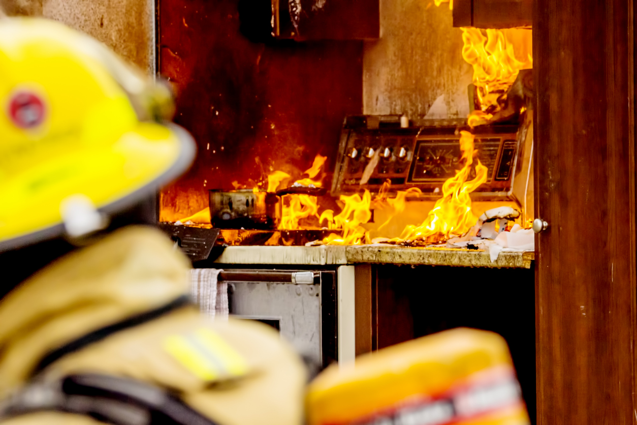 A-fire-man-putting-out-house-fires