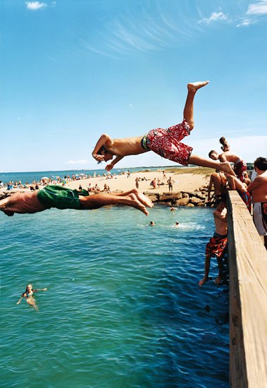 Men diving into ocean at Oak Bluffs beach
