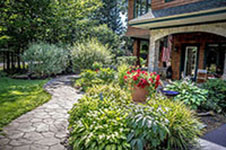 GORGEOUS contemporary Adirondack home in beautifully landscaped, certified wildlife habitat surroundings.