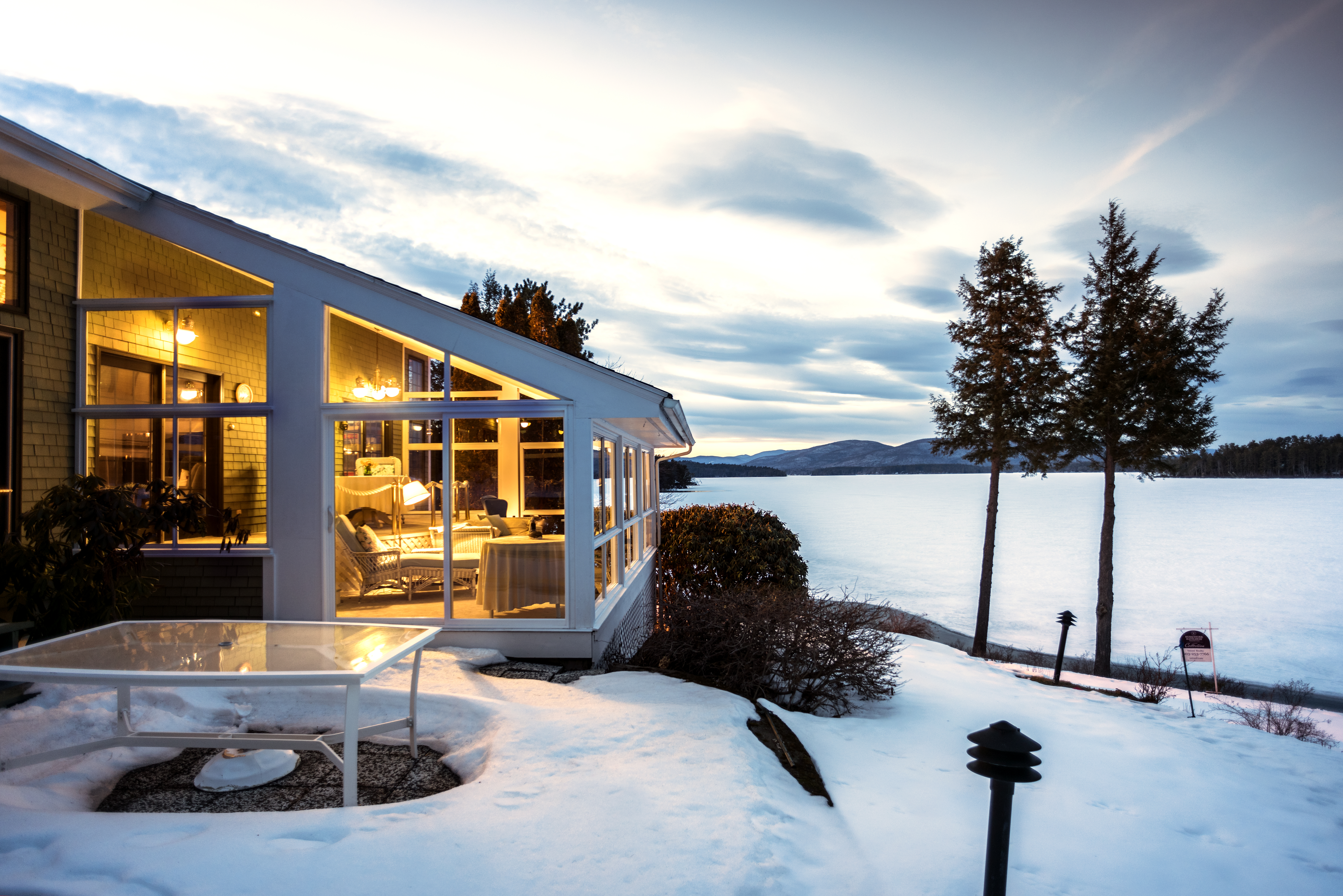 Winter views are majestic at 144 Veasey Shore on Winnipesaukee, listed by Nicole Watkins. Waterfront Real Estate Agent